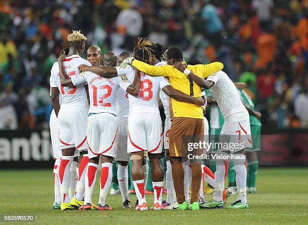 Burkina Faso players form a team huddle during the 2013 African Cup of Nations Final match between Nigeria and Burkina Faso at the National Stadium...