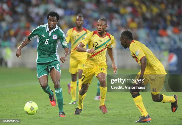 Seydou Keita of Mali and Efe Ambrose of Nigeria during the 2013 African Cup of Nations Semi-final match between Mali and Nigeria at the Moses Mabhida...