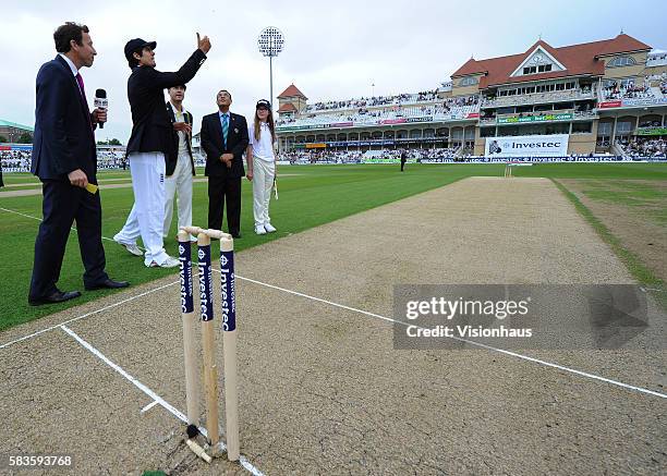 Englan Captain Alastair Cook tosses the coin before Day One of the 1st Investec Ashes Test between England and Australia at Trent Bridge in...