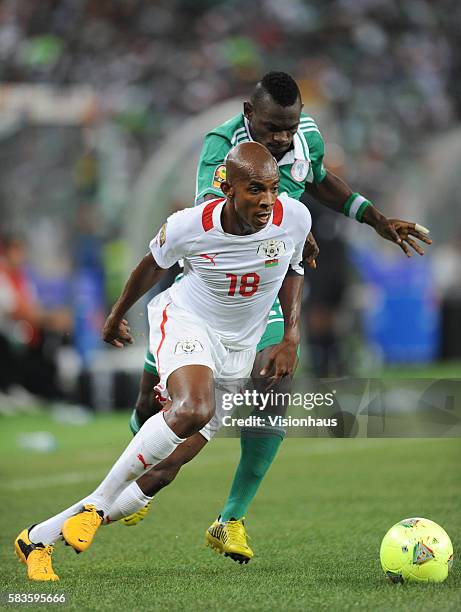 Charles Kabore of Burkina Faso and Juwon Oshaniwa of Nigeria during the 2013 African Cup of Nations Final match between Nigeria and Burkina Faso at...