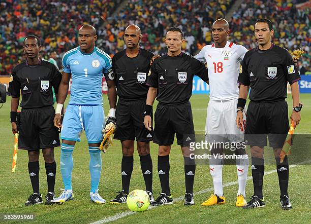 Nigeria Captain Vincent Enyeama and Burkina Faso Captain Charles Kabore pose with match officials before the 2013 African Cup of Nations Final match...
