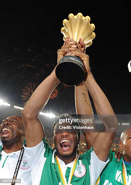 John Obi Mikel of Nigeria celebrates with the trophy after winning the 2013 African Cup of Nations Final match between Nigeria and Burkina Faso at...