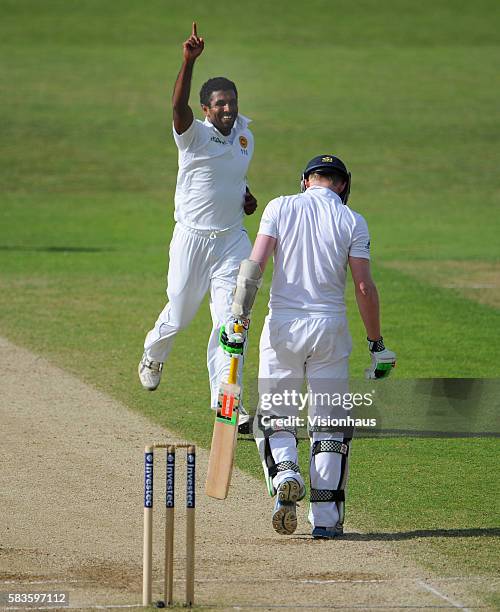 Dhammika Prasad of Sri Lanka celebrates taking the wicket of Sam Robson during Day Four of the 2nd Investec Test between England and Sri Lanka at the...