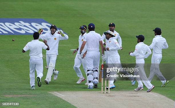 Sri Lanka celebrate as Dhammika Prasad takes the wicket of Alastair Cook during Day Two of the 2nd Investec Test between England and Sri Lanka at the...