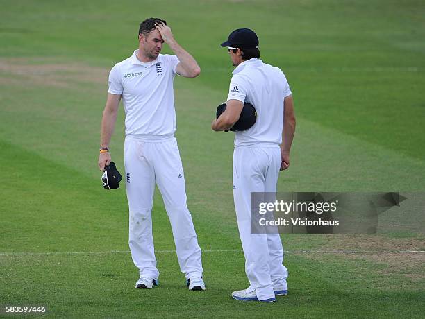 Jimmy Anderson of England cuts a frustrated figure as he talks to Alastair Cook during Day Three of the 2nd Investec Test between England and Sri...