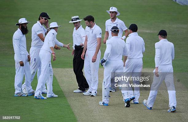 Umpire Billy Bowden tries to give Jimmy Anderson his cap after the two exchange words during Day Four of the 2nd Investec Test between England and...