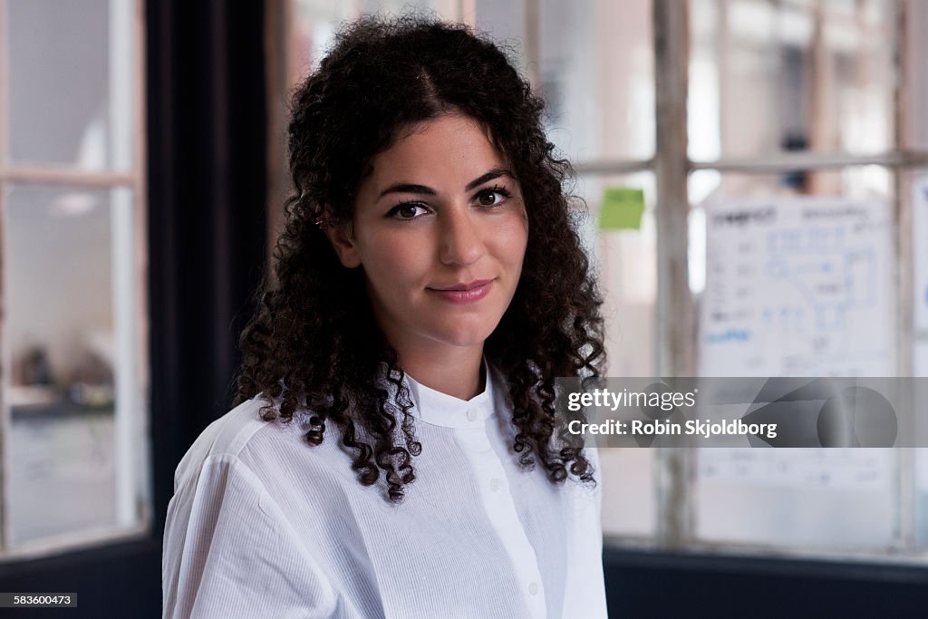 Portrait of young Woman in meeting room