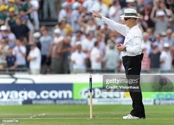 Umpire Tony Hill of New Zealand raises the finger during Day One of the 3rd Investec Ashes Test between England and Australia at Old Trafford Cricket...