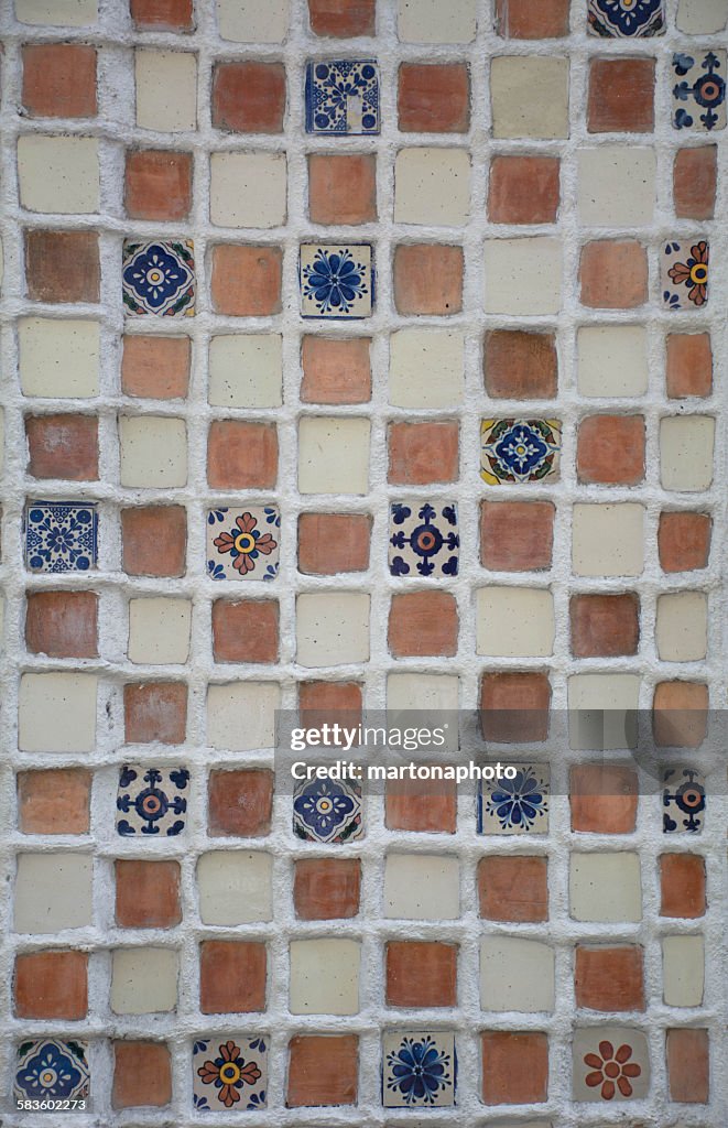 Beautiful handmade tiles forming a mosaic on a wal