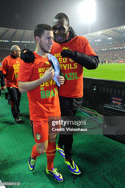Eden Hazard and Christian Benteke of Belgium celebrate qualification for the 2014 World Cup after the FIFA 2014 World Cup Qualifying Group A match...