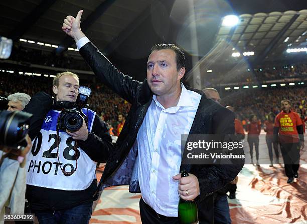 Marc Wilmots, the Belgian head coach, acknowledges the crowd during celebrations following Belgium's qualification for the World Cup Finals in Brazil...