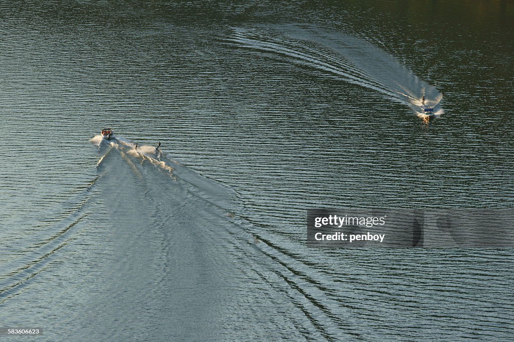 Two waterskiing boats