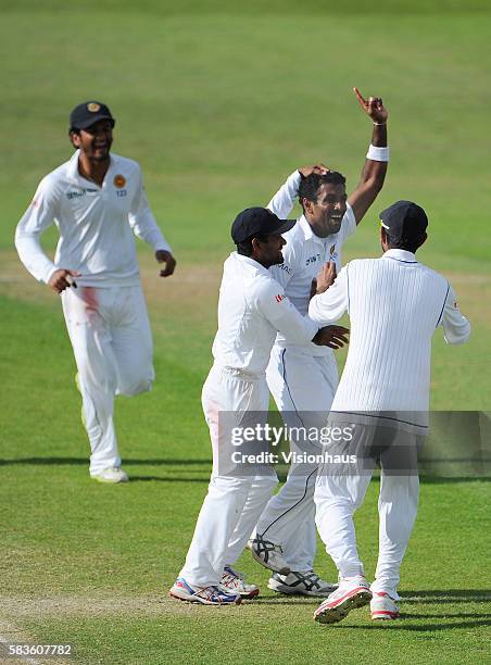 Dhammika Prasad of Sri Lanka celebrates taking the wicket of Sam Robson during Day Four of the 2nd Investec Test between England and Sri Lanka at the...