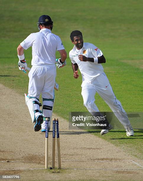 Dhammika Prasad of Sri Lanka celebrates taking the wicket of Ian bell during Day Four of the 2nd Investec Test between England and Sri Lanka at the...