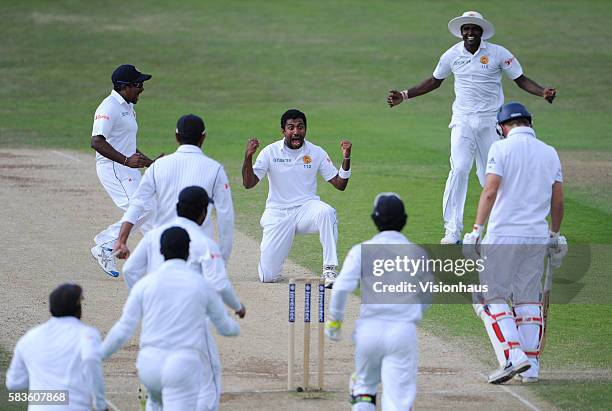 Dhammika Prasad of Sri Lanka celebrates taking the wicket of Gary Ballance during Day Four of the 2nd Investec Test between England and Sri Lanka at...