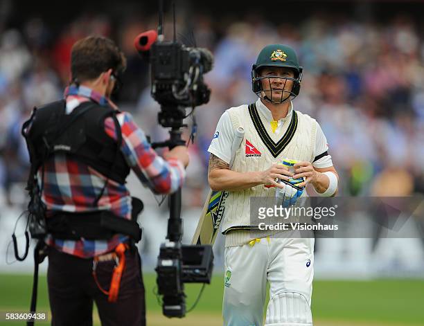 Australian Captain Michael Clarke is followed off the pitch by a Sky Sports steadicam cameraman after losing his wicket to Stuart Broad during the...