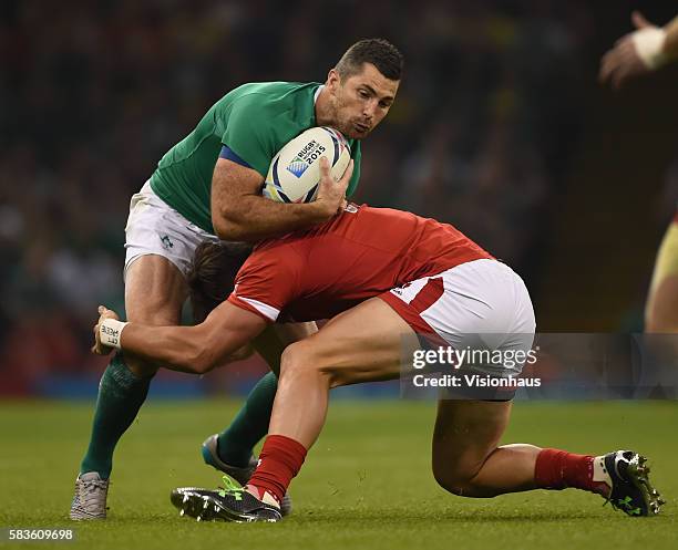 Rob Kearney of Ireland and DTH Van Der Merwe of Canada in action during the Rugby World Cup pool D group match between Ireland and Canada at the...