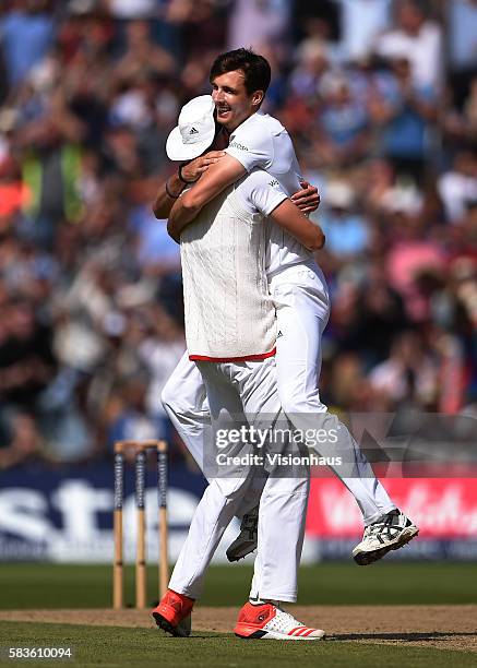 England's Steven Finn takes the wicket of Steven Smith and celebrates with Stuart Broad during the second day of the 3rd Investec Ashes Test between...