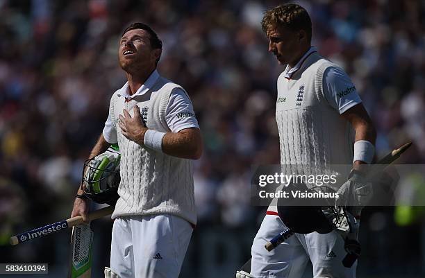 Ian Bell and Joe Root walk from the pitch after securing victory for England during the third day of the 3rd Investec Ashes Test between England and...