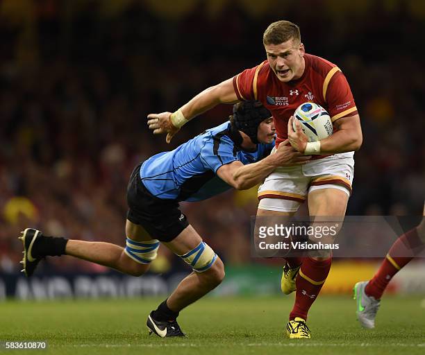Scott Williams of Wales is tackled by Matias Beer of Uruguay during the Rugby World Cup pool A group match between Wales and Uruguay at the...
