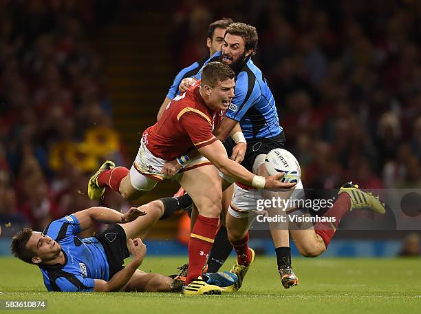 Scott Williams of Wales lays off a pass during the Rugby World Cup pool A group match between Wales and Uruguay at the Millennium Stadium in Cardiff,...