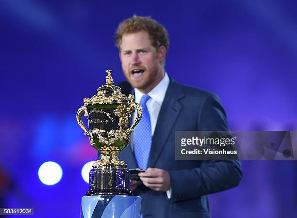 Prince Harry stands before the William Webb Ellis Cup during the opening ceremony before the Rugby World Cup 2015 Group A match between England and...