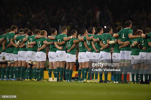 The Ireland team line up to sing their national anthem before the Rugby World Cup 2015 Pool D match between France and Ireland at The Millenium...