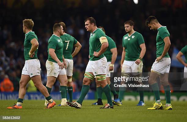 Dejected Irish team leave the field after the Rugby World Cup quarter final match between Ireland and Argentina at the Millennium Stadium in Cardiff,...
