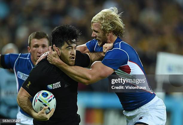 Nehe Milner-Skudder of New Zealand is tackled by Conrad Marais of Namibia during the Rugby World Cup 2015 Group C match between New Zealand and...