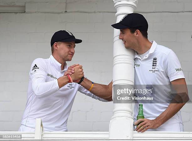 Joe Root and Steven Finn celebrate over a beer after England regained The Ashes during the third day of the 4th Investec Ashes Test between England...