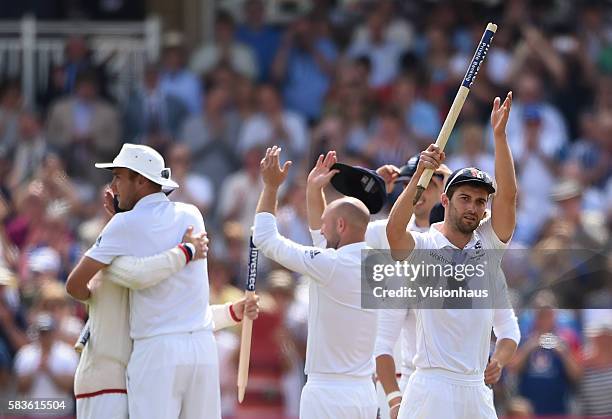 Mark Wood raises his souvenir stump in celebration as England win the match and regain The Ashes during the third day of the 4th Investec Ashes Test...