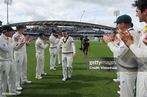 Australia Captain Michael Clarke is applauded off the field by his team at the end of his final test match before retiring during the fourth day of...