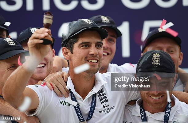 England Captain Alastair Cook raises the Ashes urn during the fourth day of the 5th Investec Ashes Test between England and Australia at The Kia Oval...