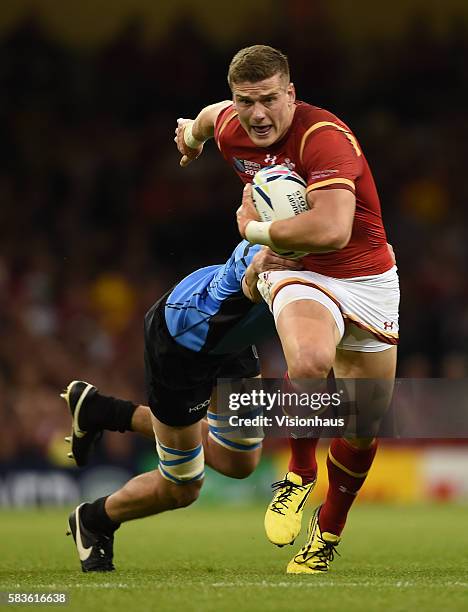 Scott Williams of Wales is tackled by Matias Beer of Uruguay during the Rugby World Cup pool A group match between Wales and Uruguay at the...