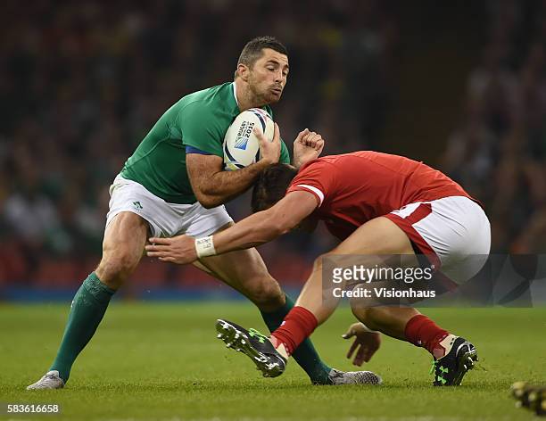 Rob Kearney of Ireland and DTH Van Der Merwe of Canada in action during the Rugby World Cup pool D group match between Ireland and Canada at the...