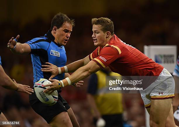 Hallam Amos of Wales and Juan Gaminara of Uruguay in action during the Rugby World Cup pool A group match between Wales and Uruguay at the Millennium...
