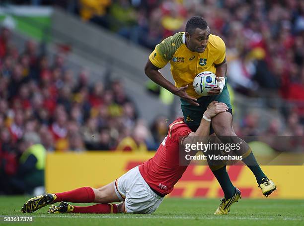 Tevita Kuridrani of Australia is tackled by Dan Biggar of Wales during the Rugby World Cup 2015 Group A match between Australia and Wales at...