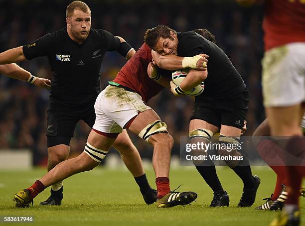 Richie McCaw of New Zealand is tackled by Yoann Maestri of France during the Rugby World Cup quarter final match between New Zealand and France at...