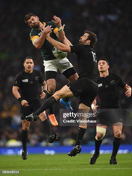 Willie Le Roux of South Africa and Conrad Smith of New Zealand in action during the Rugby World Cup semi final match between South Africa and New...