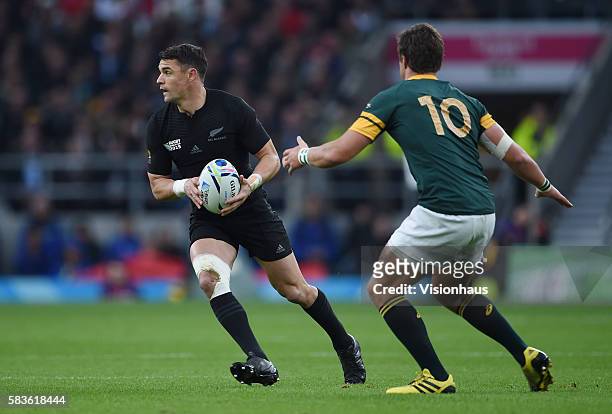 Dan Carter of New Zealand and Handre Pollard of South Africa during the Rugby World Cup 2015 Semi-Final match between South Africa and New Zealand at...