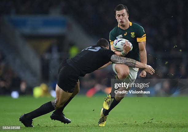 Handre Pollard of South Africa is tackled by Sonny Bill Williams of New Zealand during the Rugby World Cup 2015 Semi-Final match between South Africa...