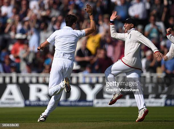 England's Steven Finn celebrates taking the wicket of Michael Clarke with Joe Root during the second day of the 3rd Investec Ashes Test between...