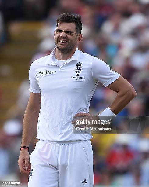 James Anderson holds his side after injuring it during the second day of the 3rd Investec Ashes Test between England and Australia at Edgbaston...