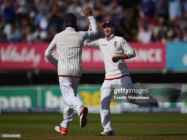 Adam Lyth celebrates catching David Warner wth Moeen Ali during the second day of the 3rd Investec Ashes Test between England and Australia at...