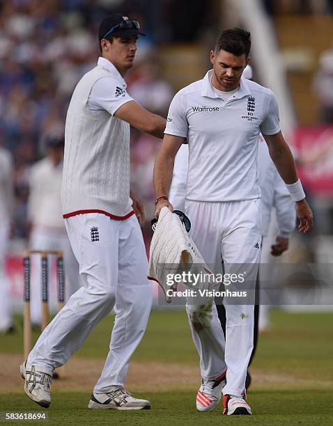 Steven Finn pats on James Anderson on the back as Anderson walks off with a side injury during the second day of the 3rd Investec Ashes Test between...