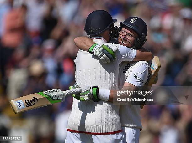 Ian Bell and Joe Root celebrate as England beat Australia during the third day of the 3rd Investec Ashes Test between England and Australia at...