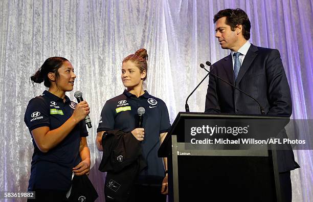 Darcy Vescio of the Blues and Briana Davey of the Blues chat with Gillon McLachlan, Chief Executive Officer of the AFL during the Women's League...