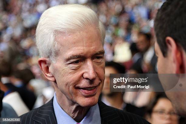 Former California governor Gray Davis talks with a delegate on the second day of the 2016 Democratic National Convention at Wells Fargo Center on...