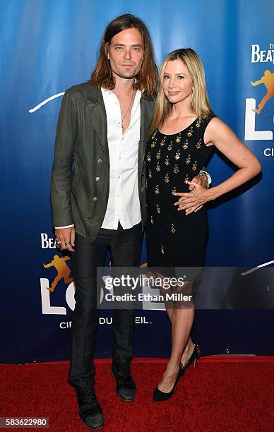 Actor/director Christopher Backus and actress Mira Sorvino attend the 10th anniversary celebration of "The Beatles LOVE by Cirque du Soleil" at The...