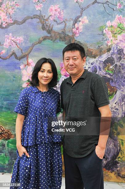 Actress Carina Lau visits painter Zhou Chunya at Chengdu Blueroof Art Gallery on July 26, 2016 in Chengdu, Sichuan Province of China.